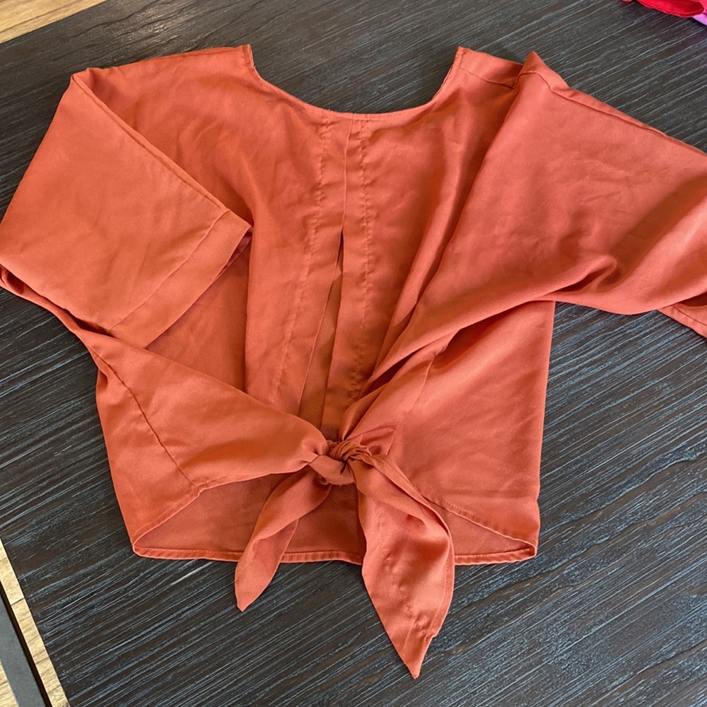 3/$15. Young ladies burnt orange blouse by Poetry in size medium.
